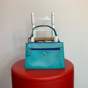 Giani Bernini Wristlet. Teal and blue.